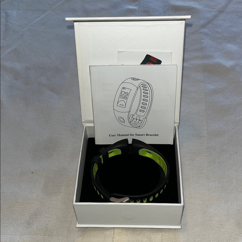 Smart Bracelet with Green and Black Band Replacement.